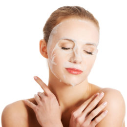Beautiful woman with collagen mask on face.